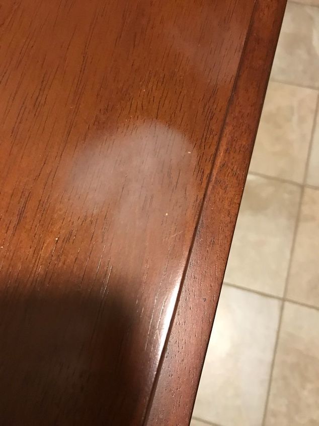 q how can i remove this wax mark from my table