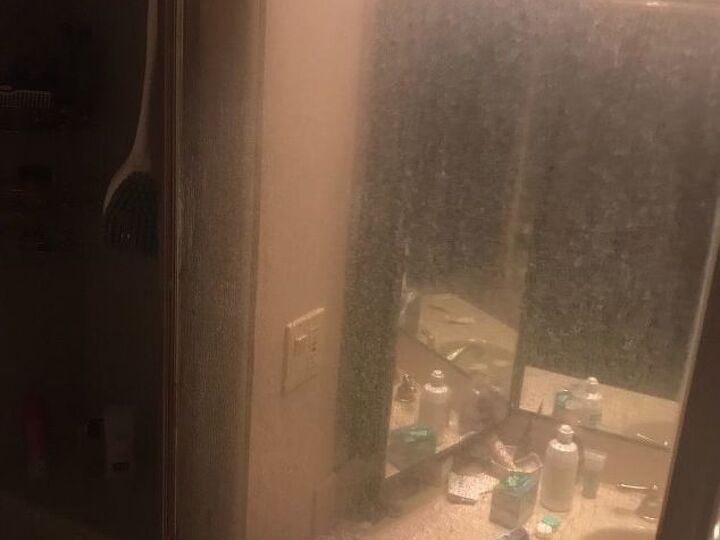 q how do you clean the grim build up on a shower door