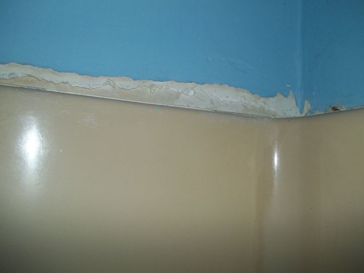 q what do i do to repair the damaged drywall above my bathtub surround
