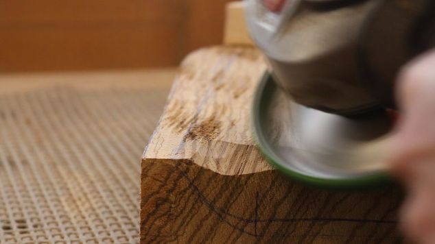 carving a workshop stool with an angle grinder