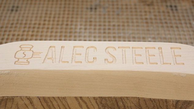 carving a workshop stool with an angle grinder
