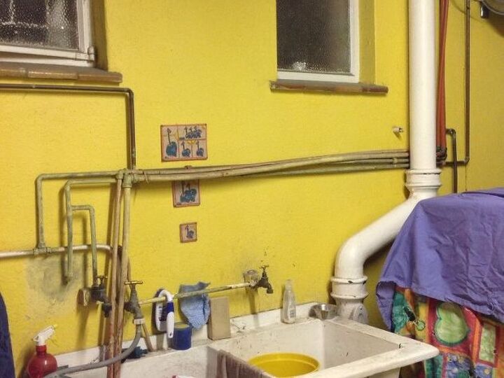 q how can i cover these ugly water pipes without grinding the wall