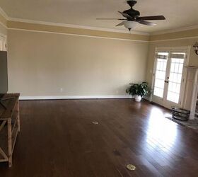 q help me design and furnish this long living room