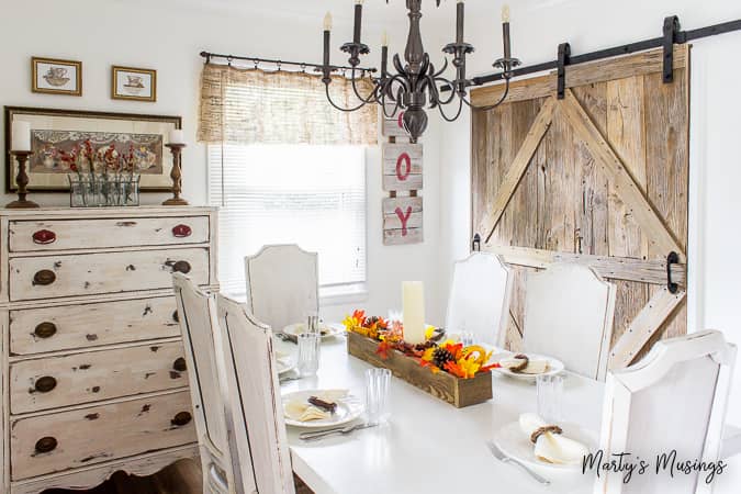 one of a kind sliding barn door with a pet door built in it