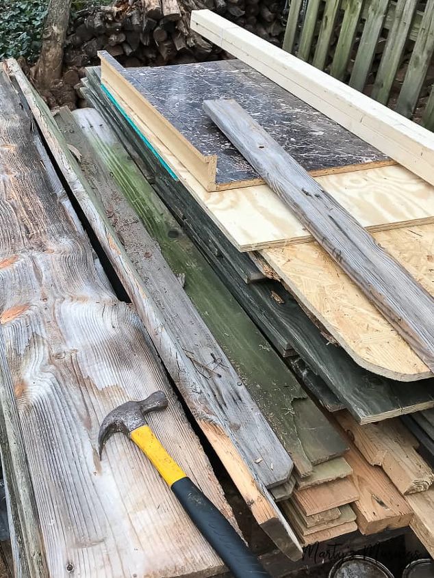 one of a kind sliding barn door with a pet door built in it