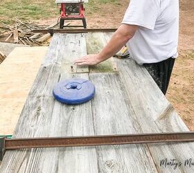 one of a kind sliding barn door with a pet door built in it