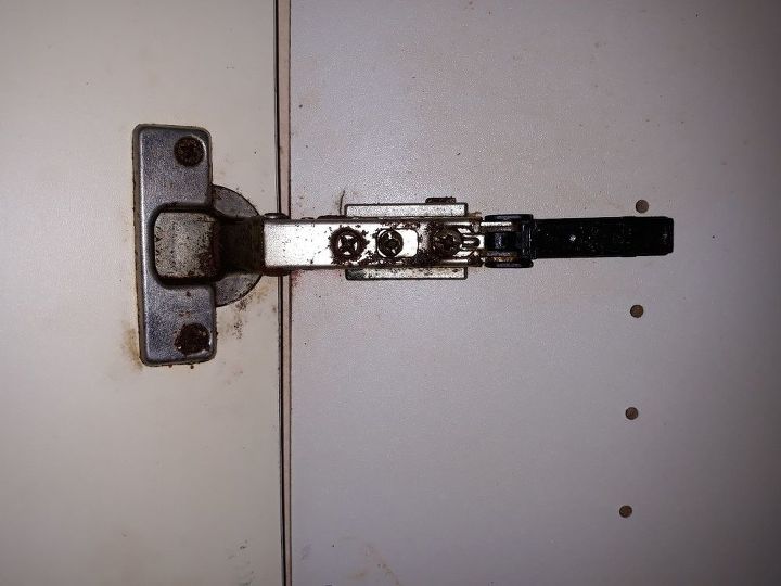 q how can i fix this loose hinge on the cupboard door