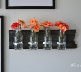 s 31 creative ways to fill empty wall space, Infuse color with hanging flower vases