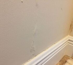 how to fixed water damage raised section of wall