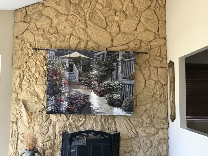 q anybody have an idea how e can update this stone wall without tearing