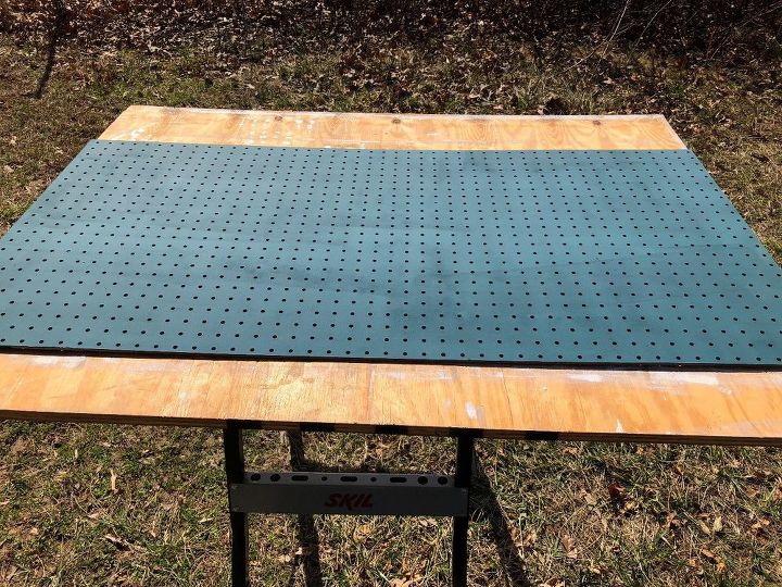 teal and gold pegboard with wall bumpers