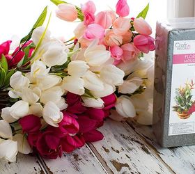 Instead of a wreath, use an armful of fake flowers to do this