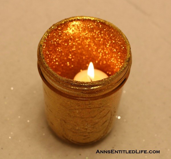 s 25 ways to use those pickle jars you ve been saving, A holiday candle glitter jar