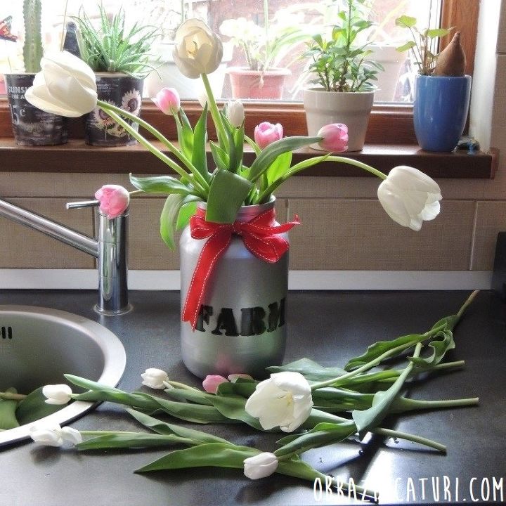 s 25 ways to use those pickle jars you ve been saving, A metallic countertop vase