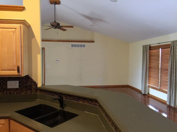 q how to decorate a boring vaulted ceiling wall with a bent near the top