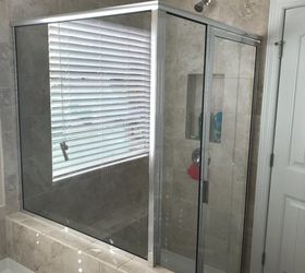 q what s the best way to clean the glass shower door and walls in my n