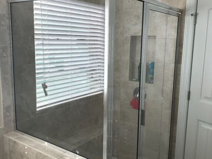 q what s the best way to clean the glass shower door and walls in my n