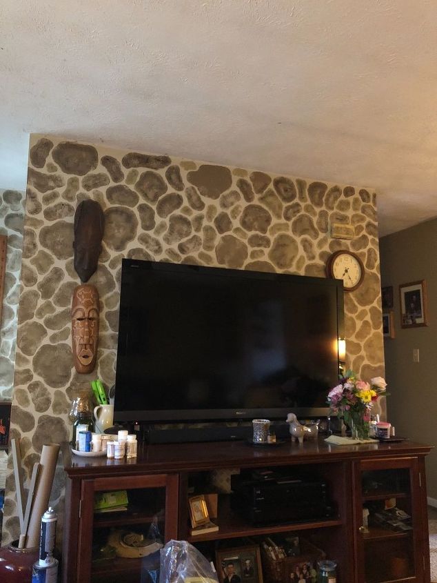 q decorating around a large flatscreen tv