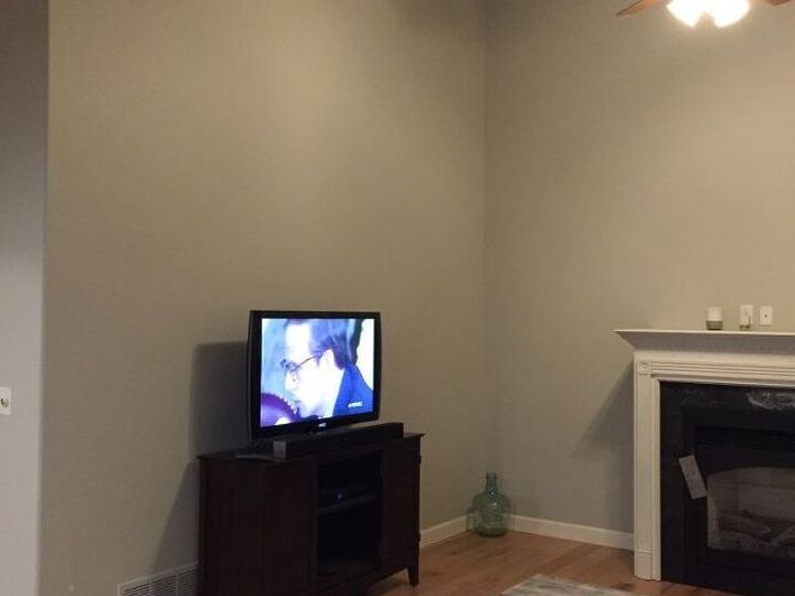 q need advice on how to decorate walls that have a high angled ceiling