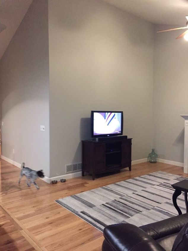q need advice on how to decorate walls that have a high angled ceiling