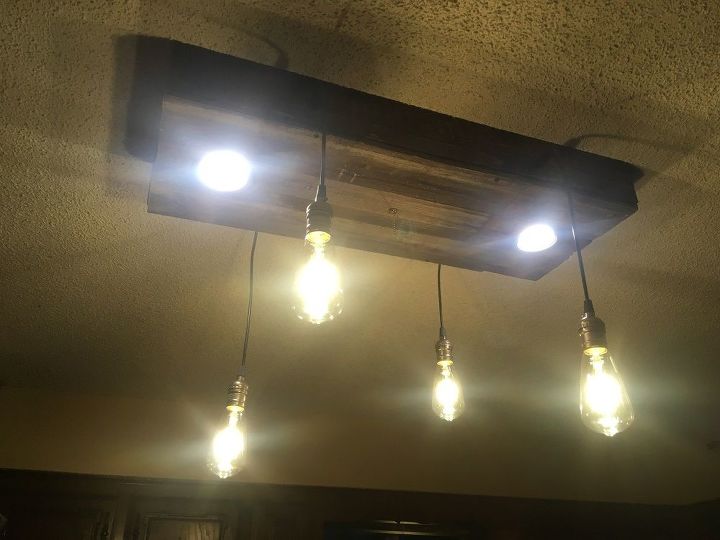 luces de lata en un accesorio de luz rstico hecho en casa