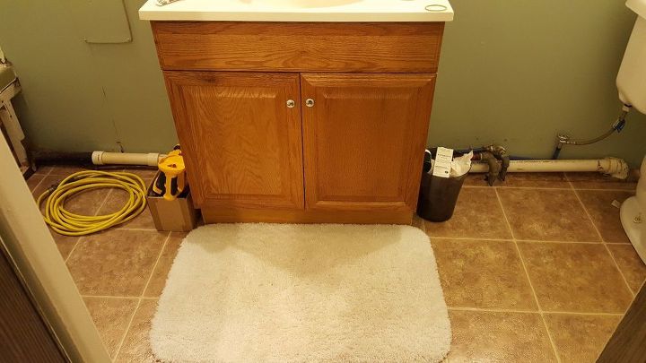 q how to hide pipes in bathroom