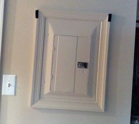 ideas to cover the unsightly breaker box in living room