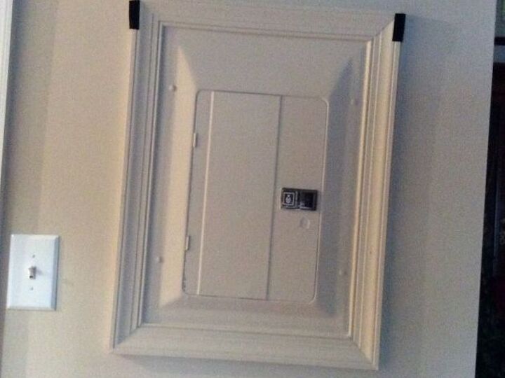 q i need something to cover the unsightly breaker box in living room