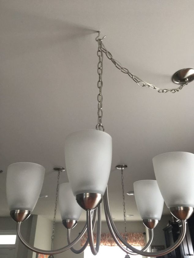 covering up a hook holding chandelier