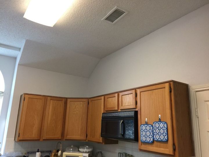 q how would you decorate above my kitchen cabinets