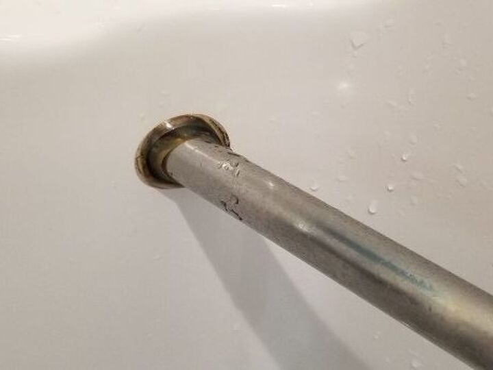 q how to fix mold behind shower stall bar