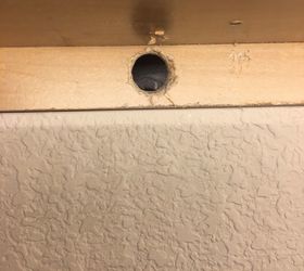 how to fill holes under cabinets