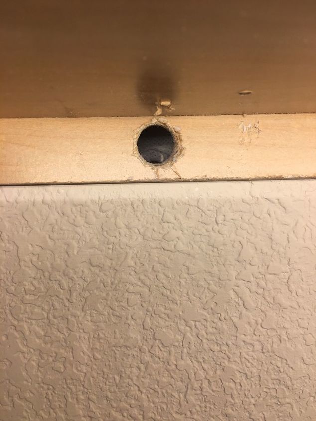 how to fill holes under cabinets