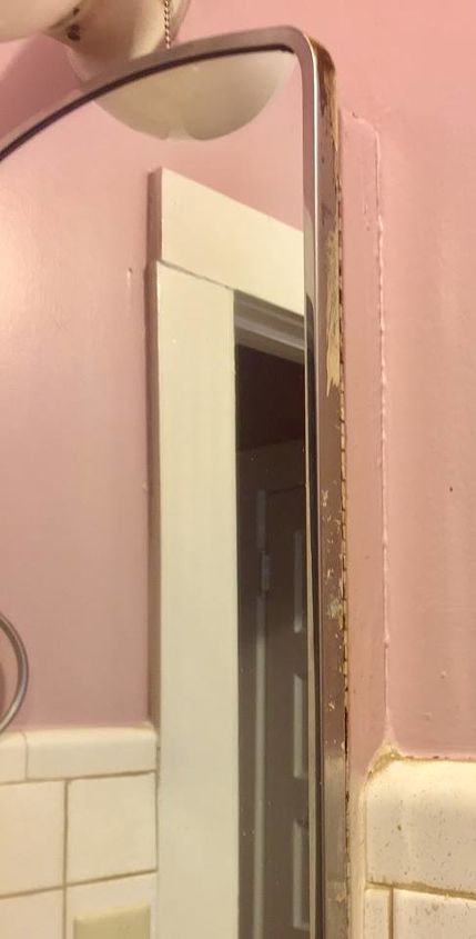 q what can i put around my bathroom mirror that is made into the wall