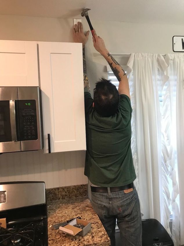 installing beadboard as backsplash and kitchen makeover for 100