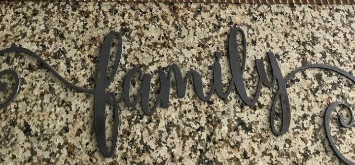 metal wood and corrugated paper family sign