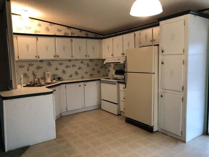 q tile over wallpaper in a kitchen backsplash