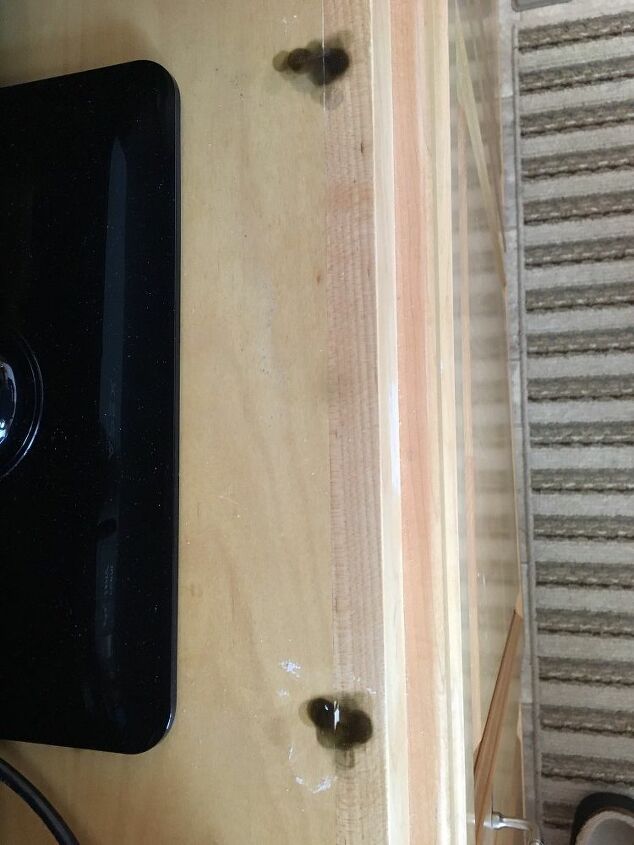 how can i remove black marks from my light wood cabinets
