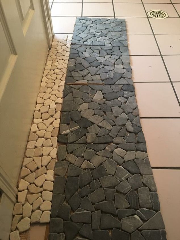 stone pebble tiles on top of old tiles