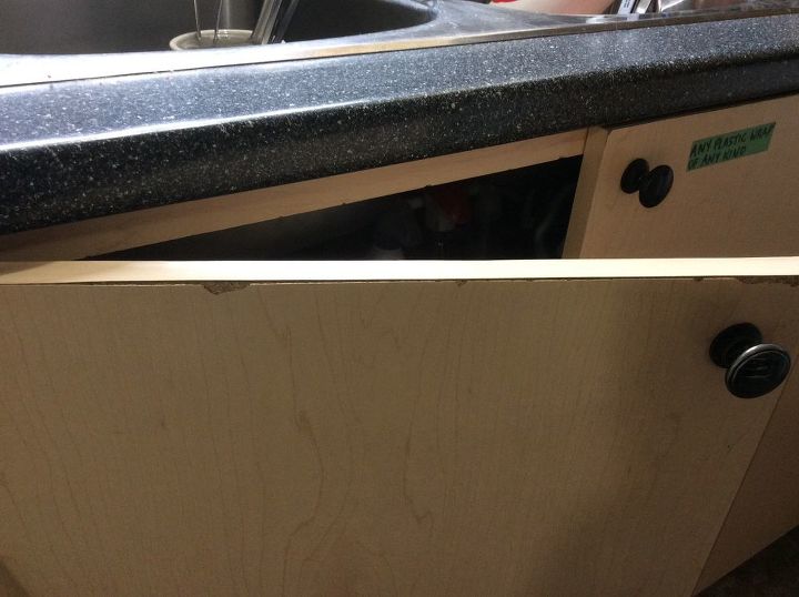 close up of chipped laminate kitchen cabinet edge vs delaminated melamine