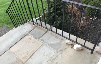 How do I remove rust stains on my outside stone steps