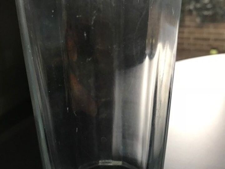 q how do i get film off glasses which are washed in dishwasher
