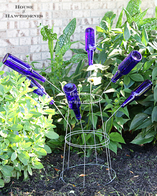 15 unconventional ways to use a tomato cage, Make a bottle tree for your garden