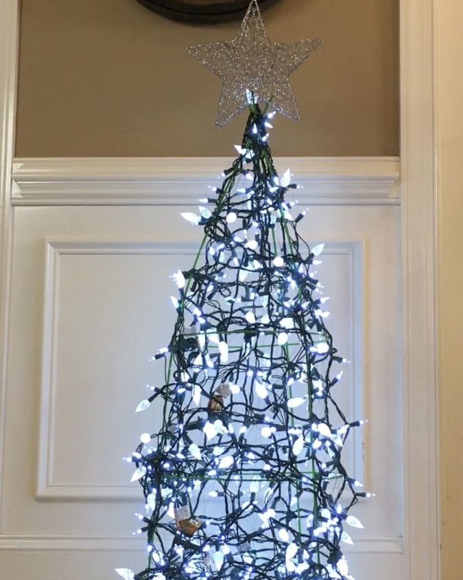 15 unconventional ways to use a tomato cage, Wrap it with lights for a Christmas Tree