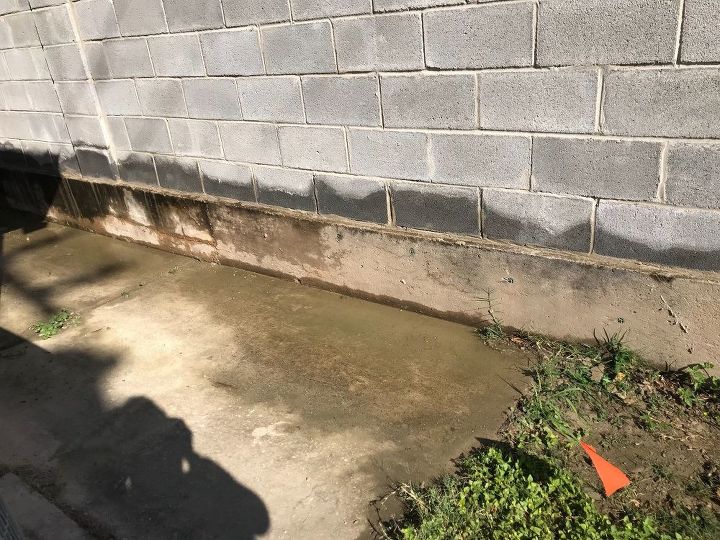 how can i keep neighbors water from sprinklers off my side of home