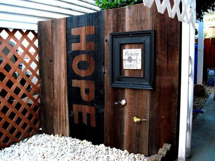 s how to get backyard privacy without a fence, Stain and paint some plank boards