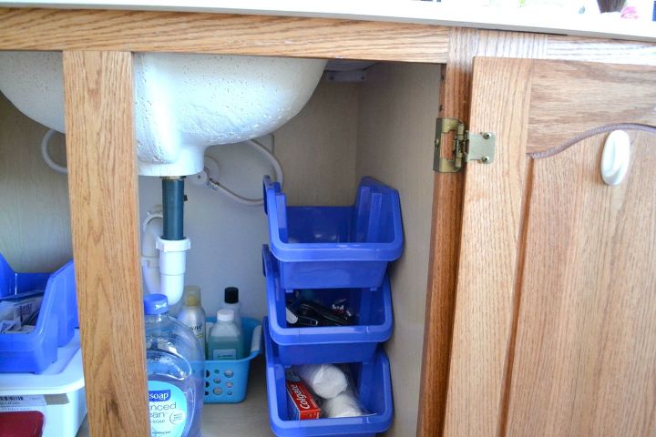 s the 15 smartest storage hacks for under your sink, Stack deep bins against one wall
