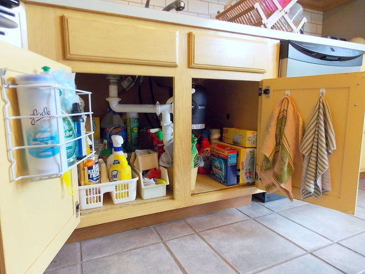 s the 15 smartest storage hacks for under your sink, Utilize your cabinet doors with hooks bins