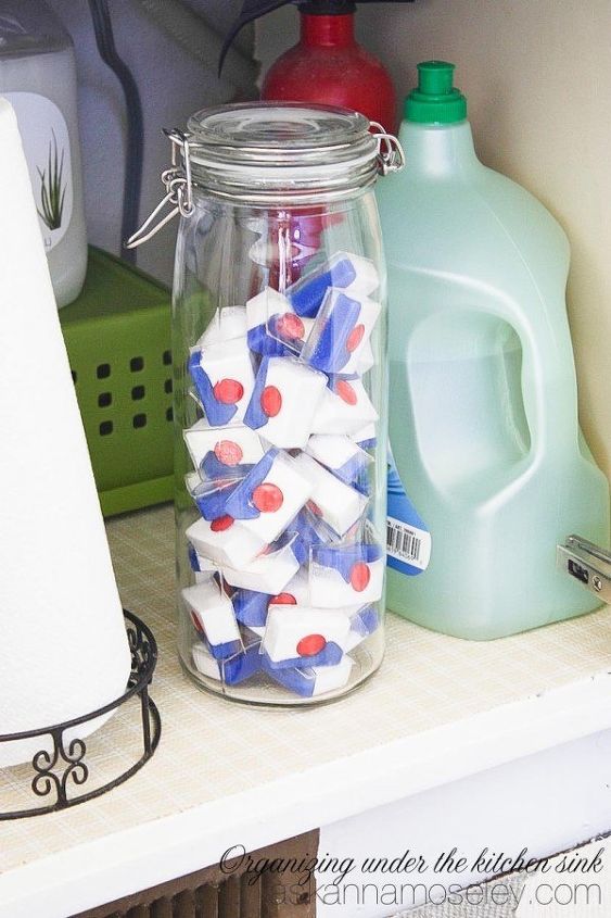 s the 15 smartest storage hacks for under your sink, Move cleaning supplies to a sleeker container
