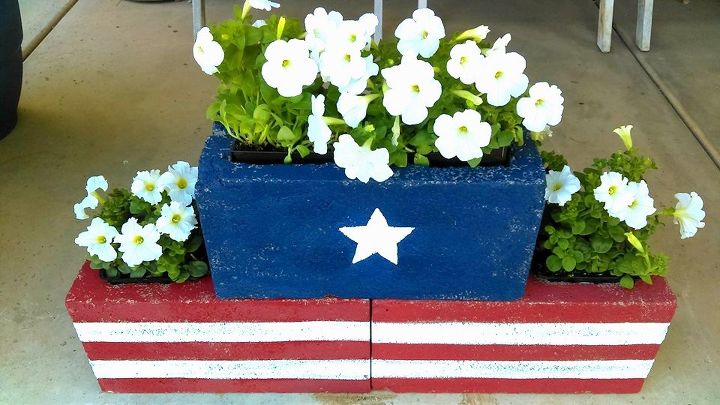 s 10 genius ways to use cinder blocks in your garden, Paint them for patriotic planters